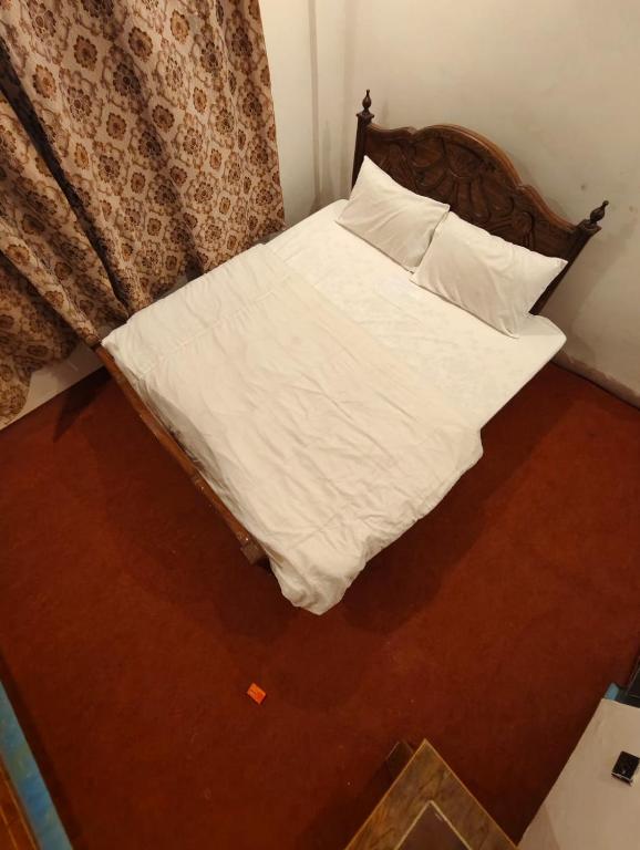 Ένα ή περισσότερα κρεβάτια σε δωμάτιο στο Skardu Luxus Hotel