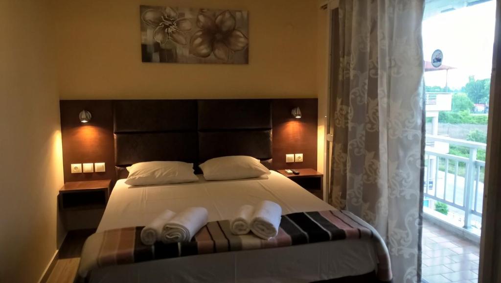 A bed or beds in a room at Apartments Palladium