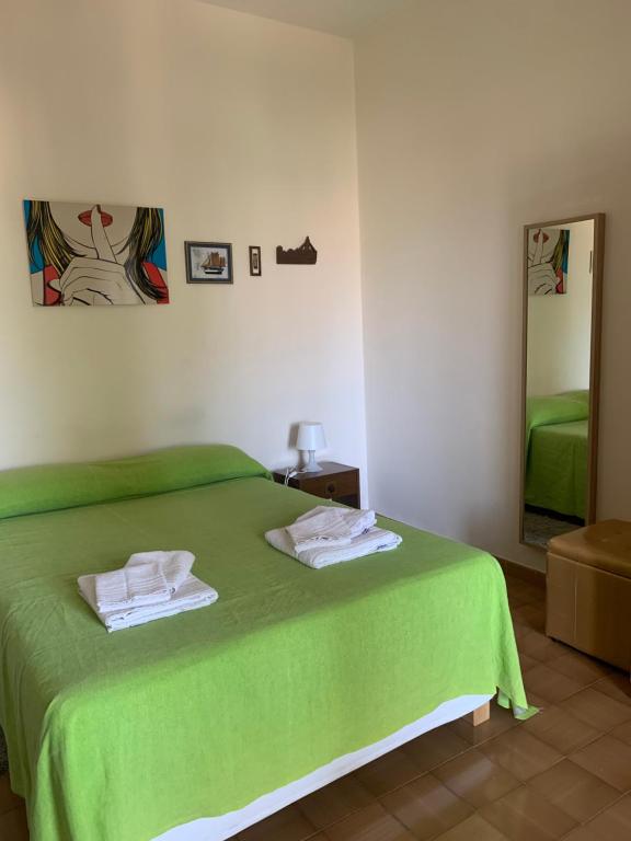 Una cama o camas en una habitación de Appartamento Rosa