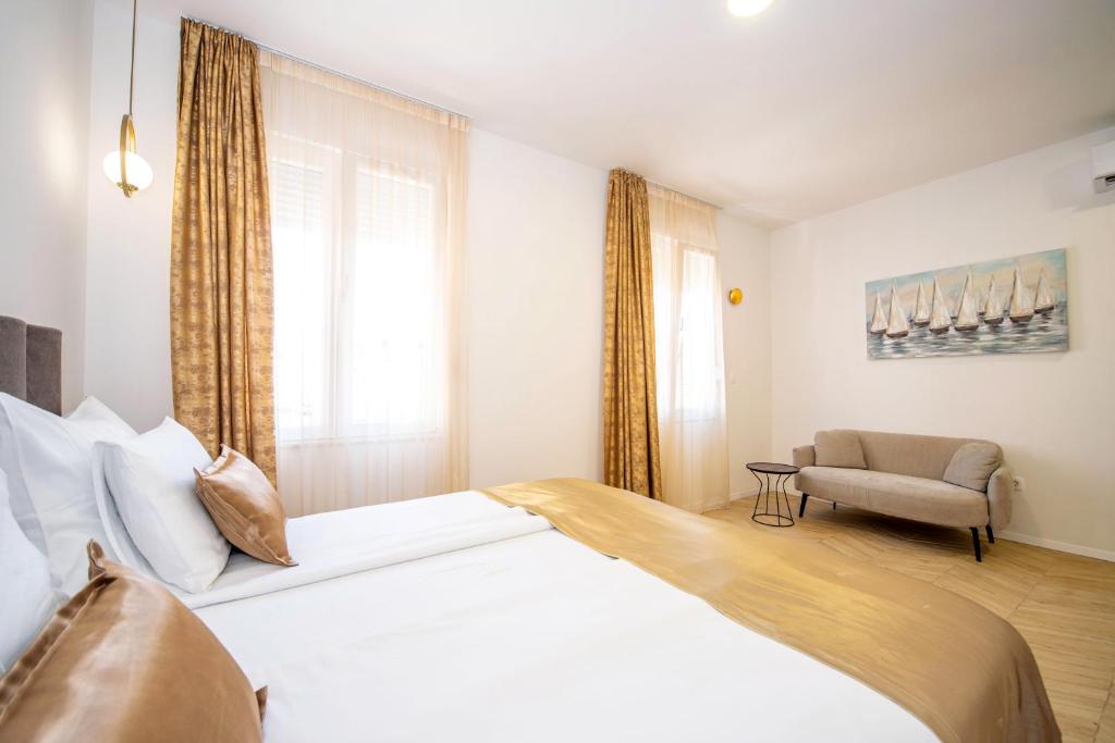 Postel nebo postele na pokoji v ubytování Mariani luxury rooms in center