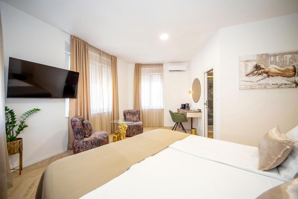 Postel nebo postele na pokoji v ubytování Mariani luxury rooms in center
