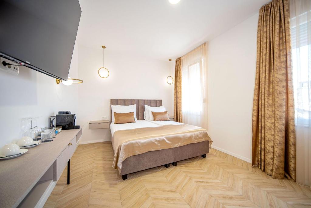 Postel nebo postele na pokoji v ubytování Mariani luxury rooms in center