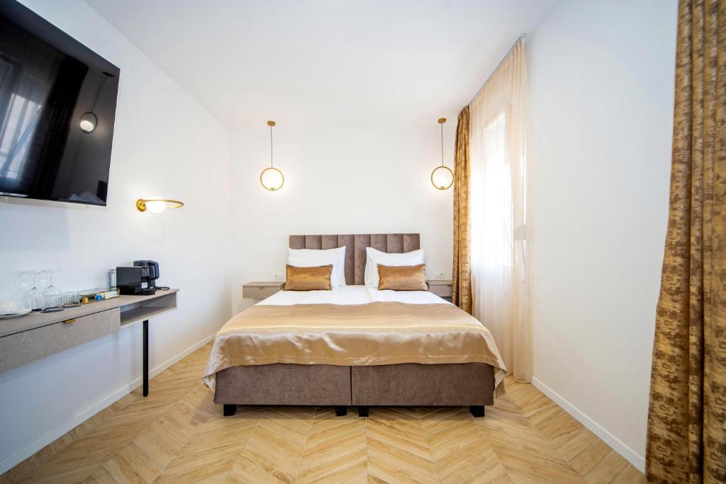 Postel nebo postele na pokoji v ubytování Mariani luxury rooms in center