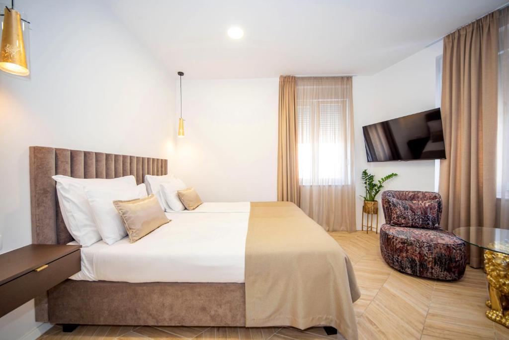 Postel nebo postele na pokoji v ubytování Mariani luxury rooms in center