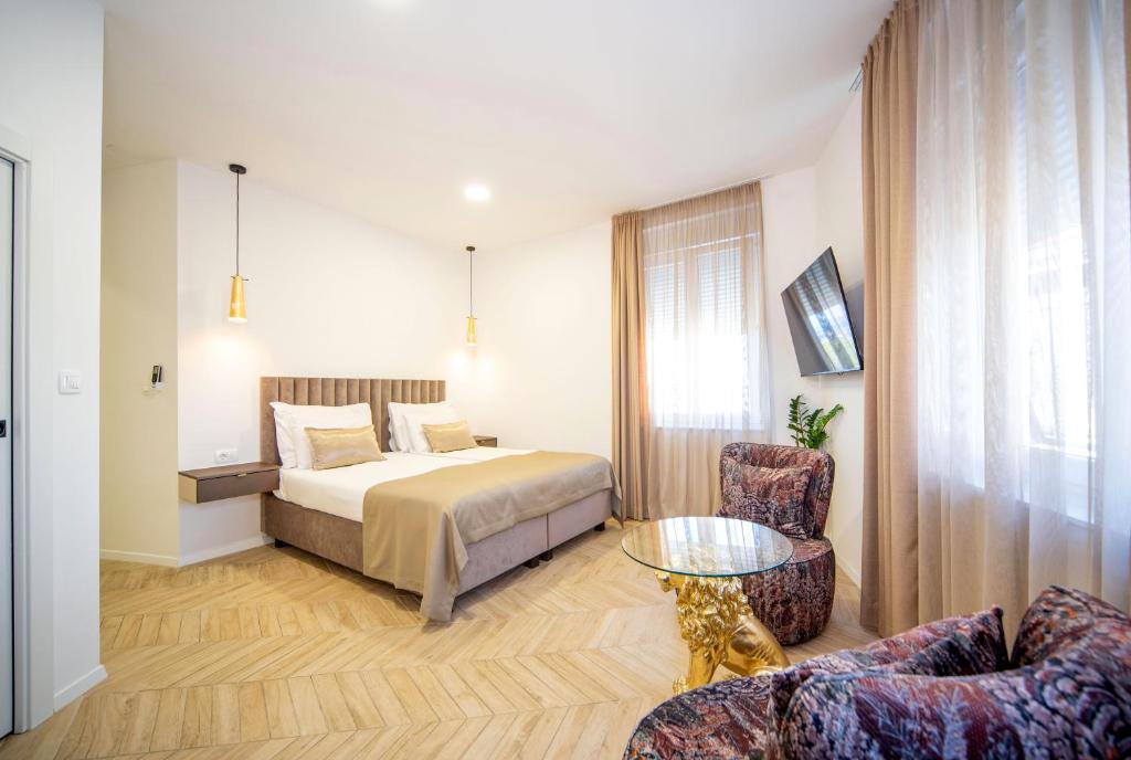 Postel nebo postele na pokoji v ubytování Mariani luxury rooms in center