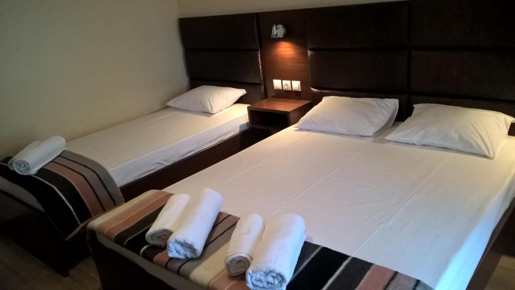A bed or beds in a room at Apartments Palladium