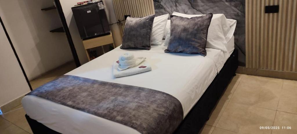 Postel nebo postele na pokoji v ubytování Hotel Centrica Del Palo 45