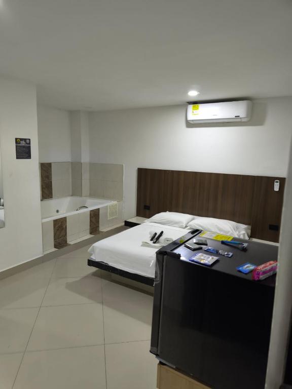 Postel nebo postele na pokoji v ubytování Hotel Centrica Del Palo 45