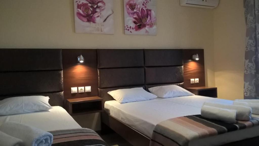 A bed or beds in a room at Apartments Palladium