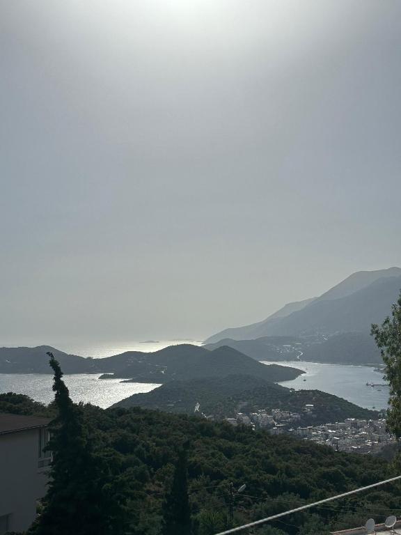 a view of a large body of water with mountains at MEY Apart in Kaş