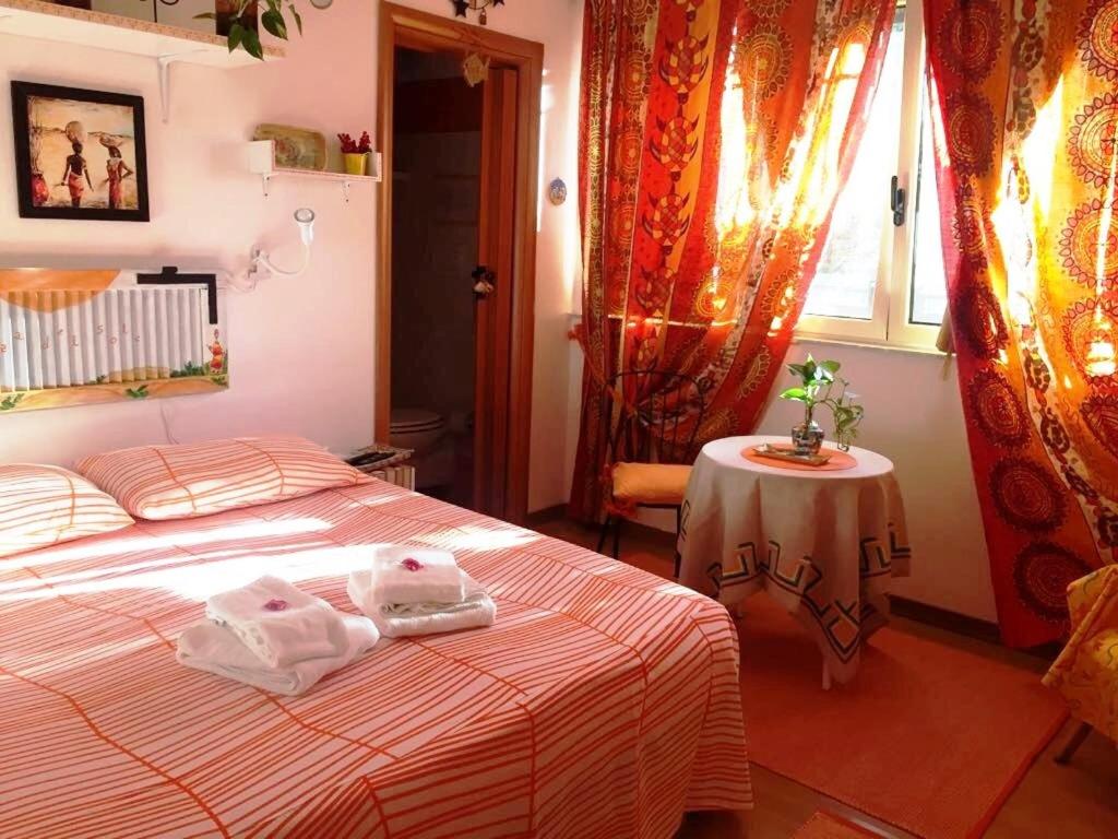 Postel nebo postele na pokoji v ubytování B&B Magna Grecia