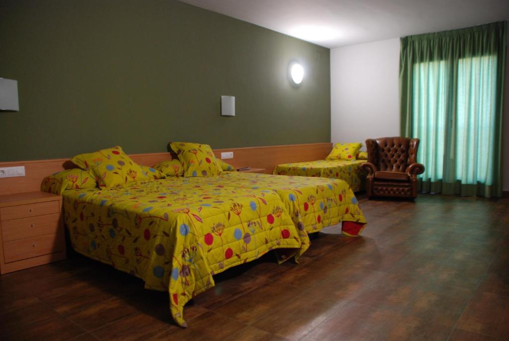 Postel nebo postele na pokoji v ubytování Hotel Pinxo
