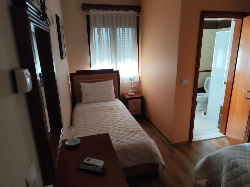 Postel nebo postele na pokoji v ubytování Hotel Theo
