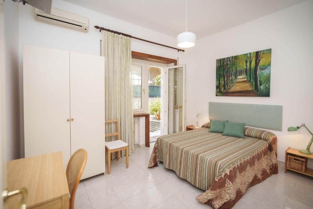 Postel nebo postele na pokoji v ubytování Le Tare B&B