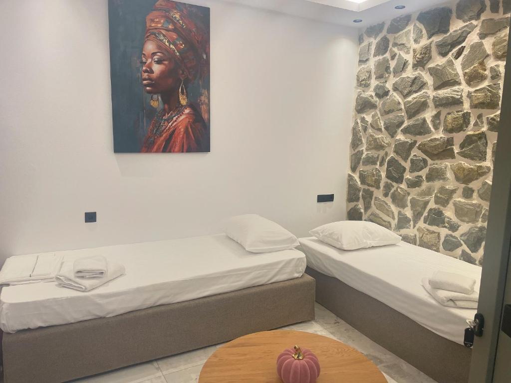 Postel nebo postele na pokoji v ubytování Latramys Suites