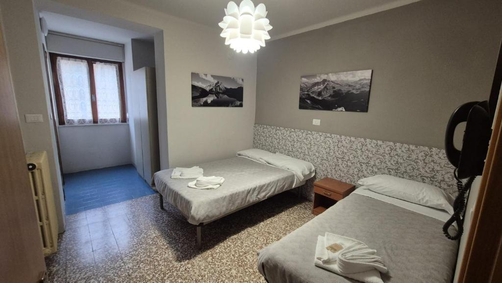 Postel nebo postele na pokoji v ubytování Albergo Valentini