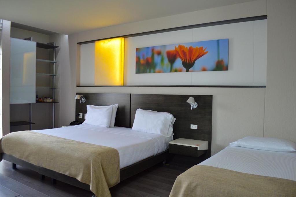 Postel nebo postele na pokoji v ubytování Inntu Hotel
