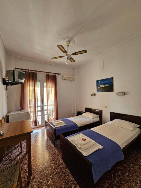 Postel nebo postele na pokoji v ubytování Dimitrouli rooms