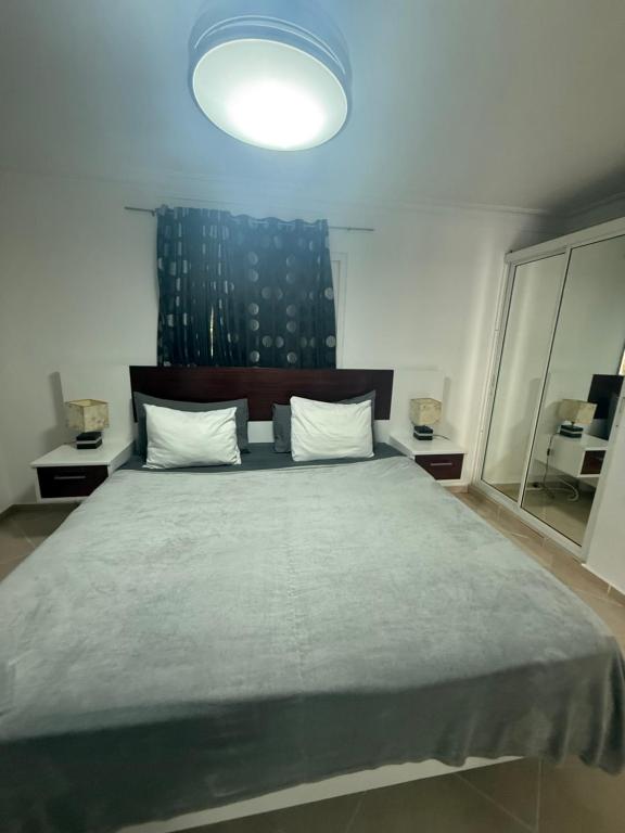Postel nebo postele na pokoji v ubytování Garden Condos 26