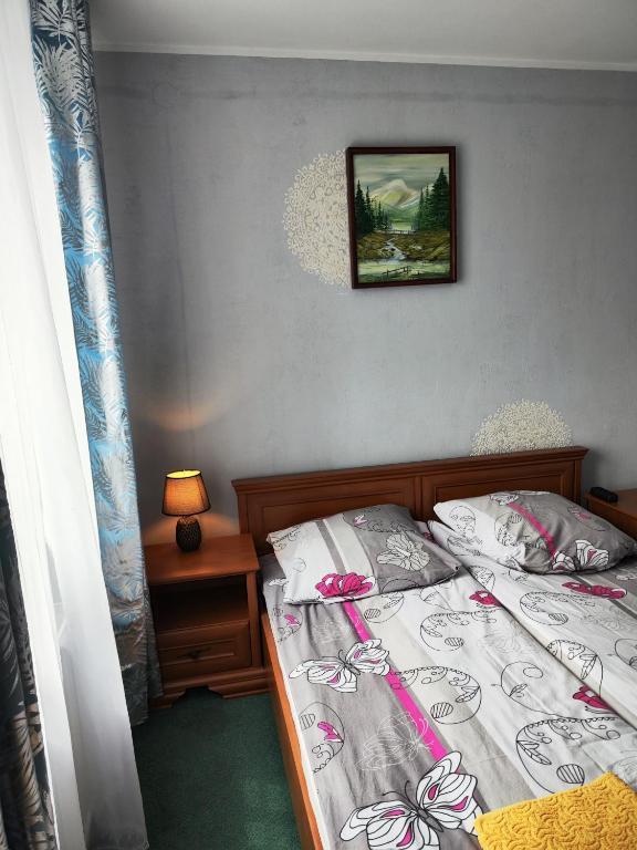 Postel nebo postele na pokoji v ubytování Michałek w Rowach