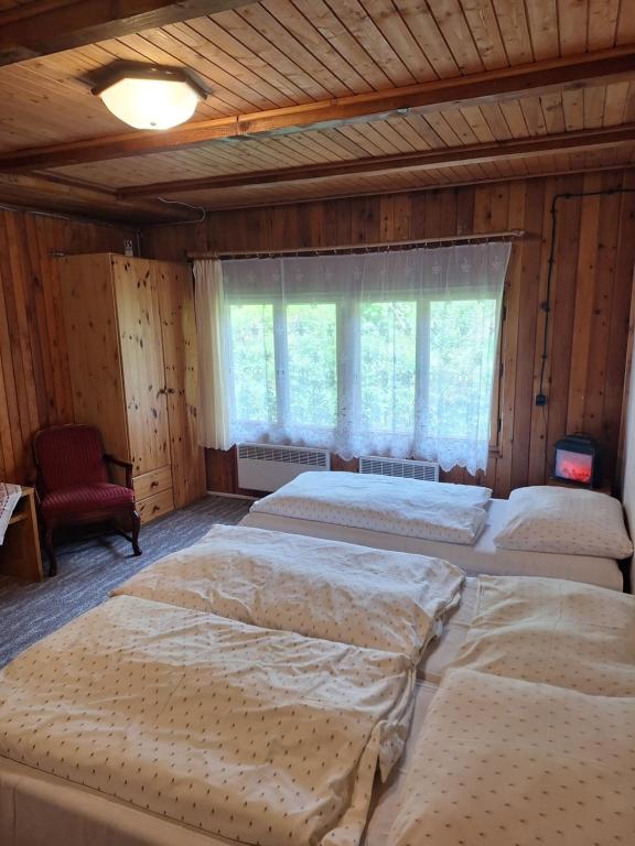 Postel nebo postele na pokoji v ubytování Turistická Chata Chopok