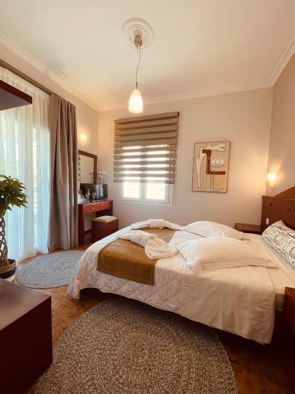 Postel nebo postele na pokoji v ubytování Semiramis Guesthouse