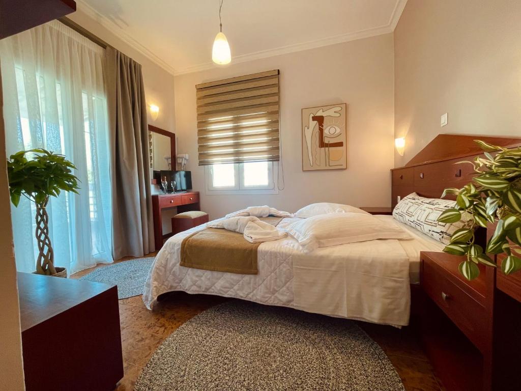 Postel nebo postele na pokoji v ubytování Semiramis Guesthouse