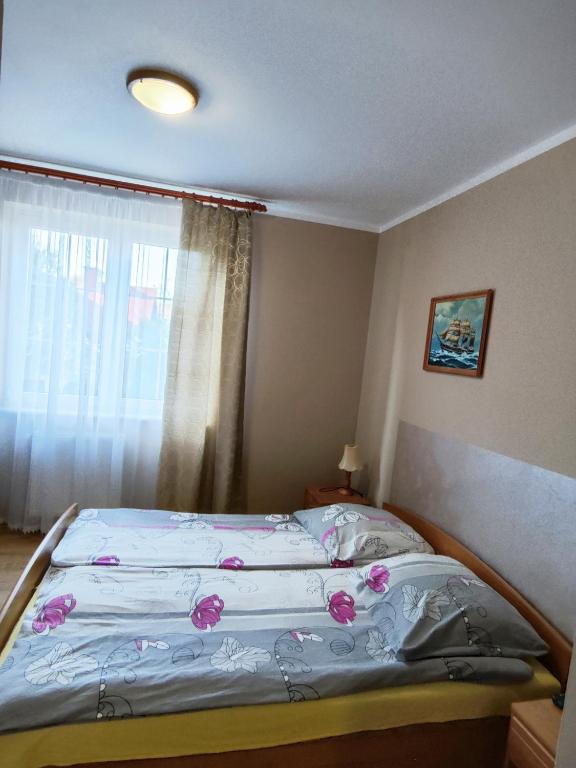 Postel nebo postele na pokoji v ubytování Michałek w Rowach