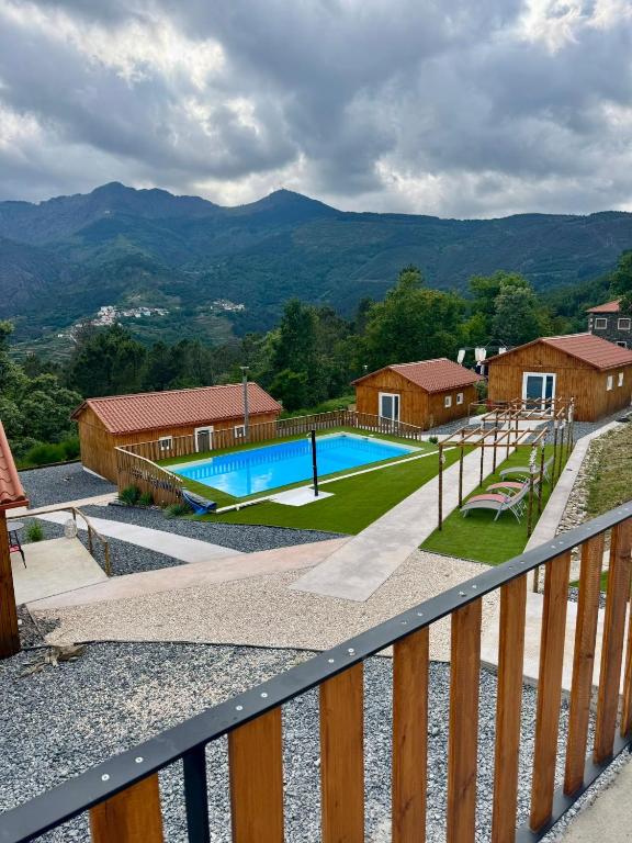 a view of a swimming pool from a balcony at Casinhas do Marão in Parada