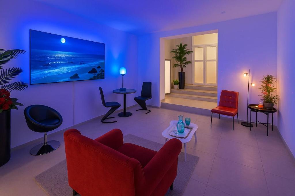 TV a/nebo společenská místnost v ubytování Alchimia Luxury Suites