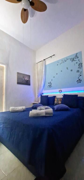 A bed or beds in a room at Casa Albergheria