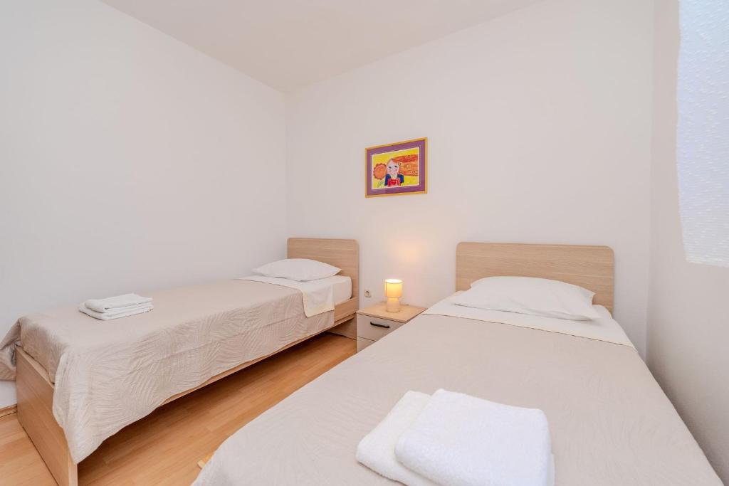 Postel nebo postele na pokoji v ubytování Apartment by the sea and with beautiful view, 2 bedrooms, 4 persons