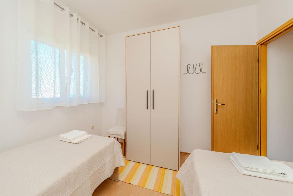 Postel nebo postele na pokoji v ubytování Apartment by the sea and with beautiful view, 2 bedrooms, 4 persons
