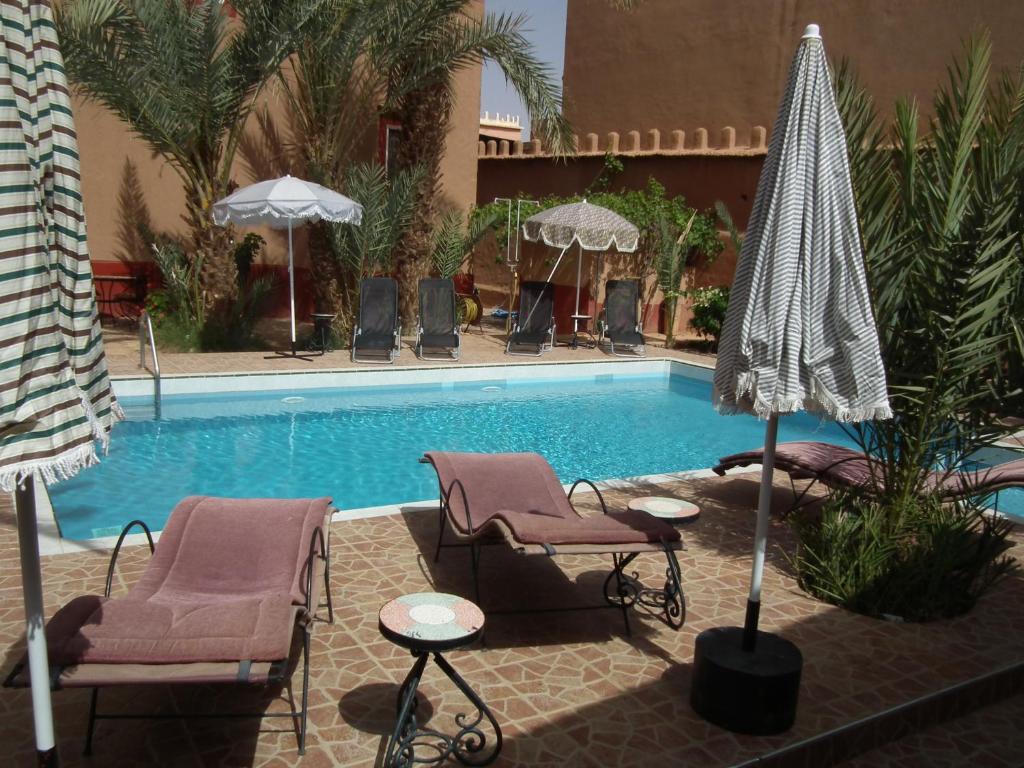 Bazén v ubytování Hotel Tomboctou nebo v jeho okolí