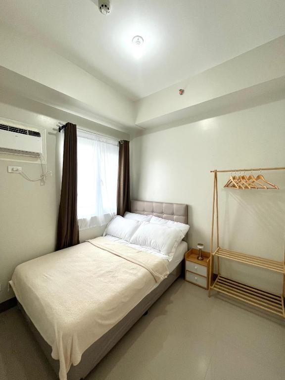 Postel nebo postele na pokoji v ubytování 1028Suites