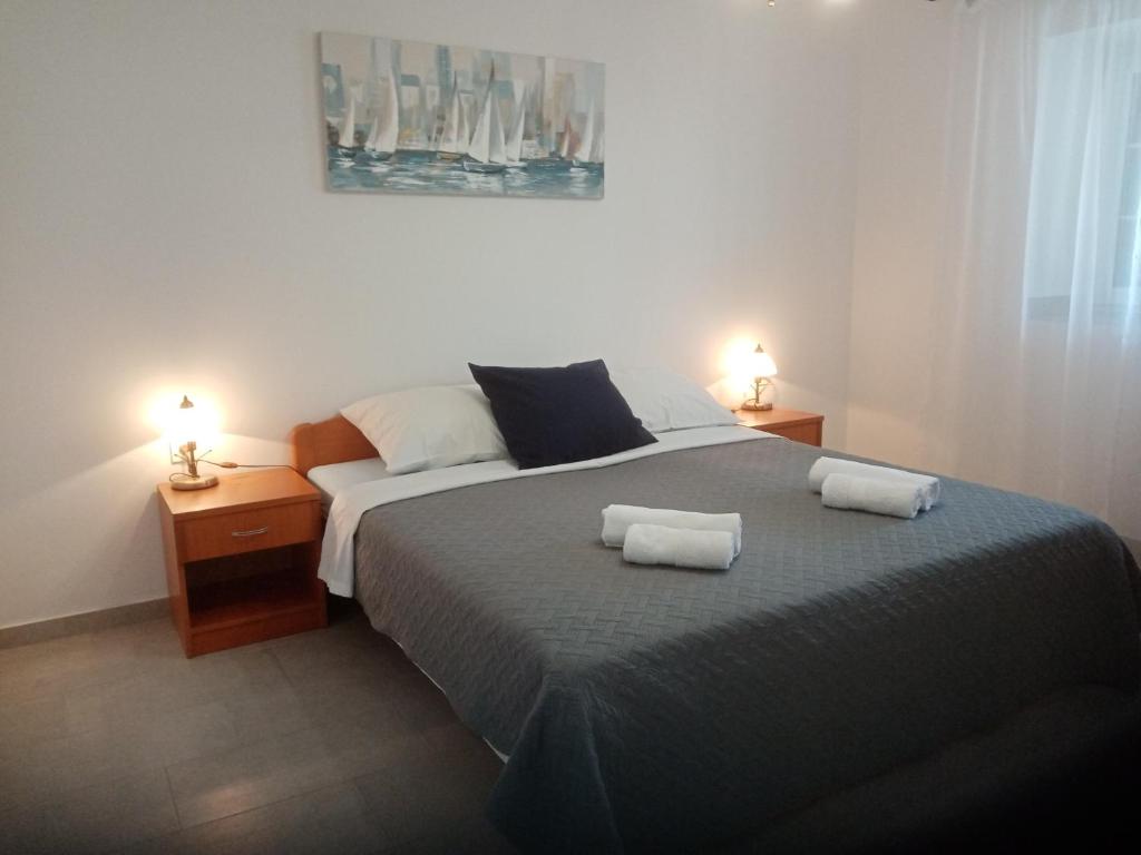 Postel nebo postele na pokoji v ubytování Apartments Marina