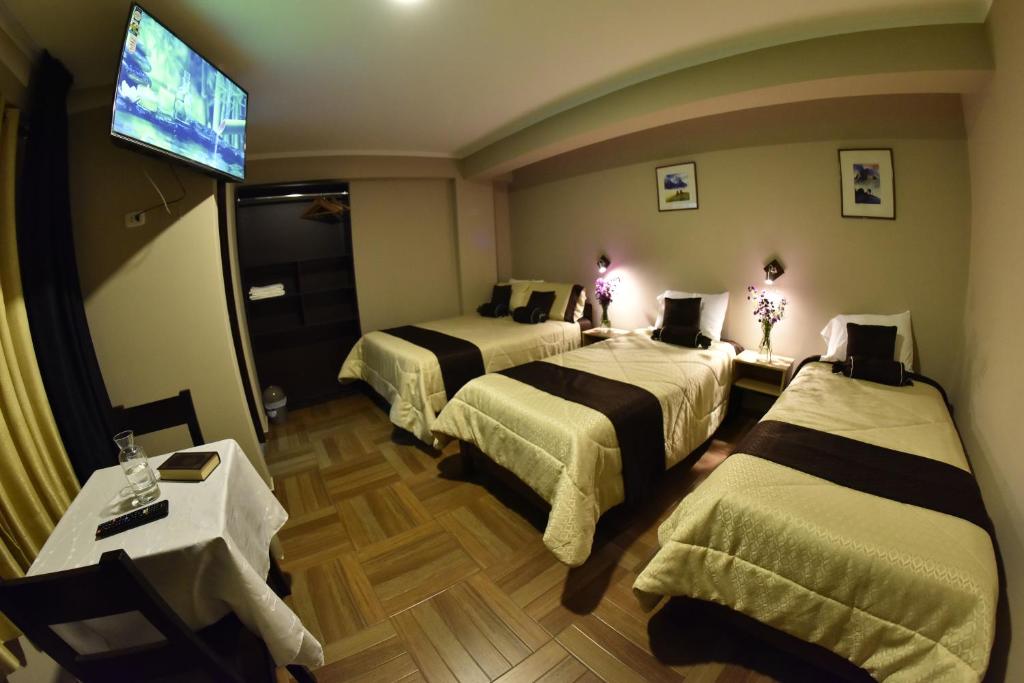 Rúm í herbergi á Hotel Golden Killa
