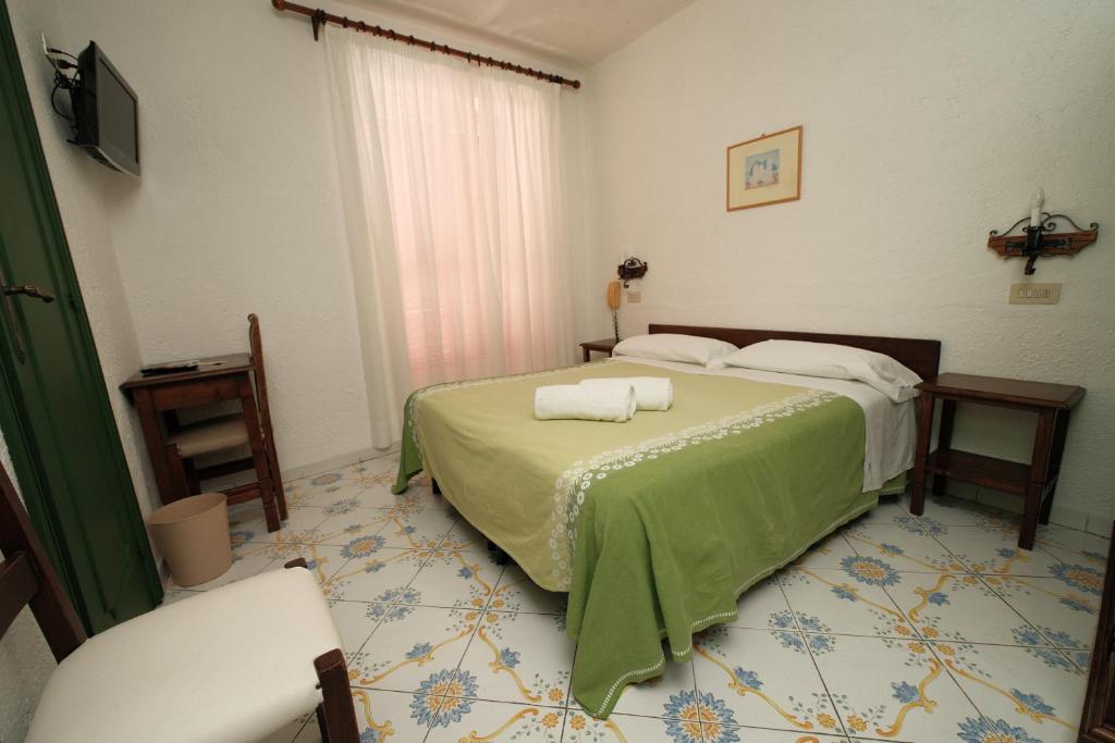 Postel nebo postele na pokoji v ubytování Hotel Don Pedro