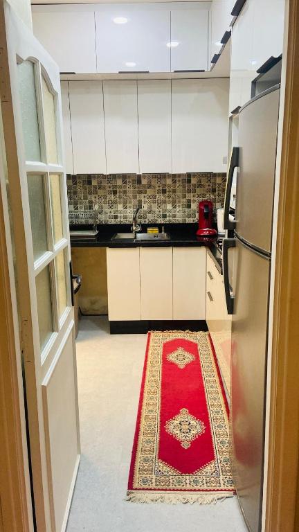 Kuchyň nebo kuchyňský kout v ubytování Appartement proche aeroport
