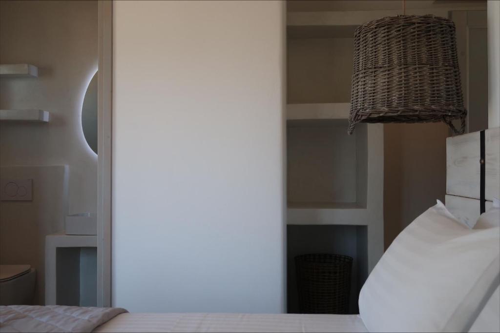 Postel nebo postele na pokoji v ubytování Elysian Villas Ios