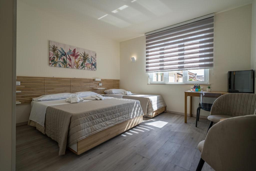 Postel nebo postele na pokoji v ubytování Rooms & Breakfast Centrale