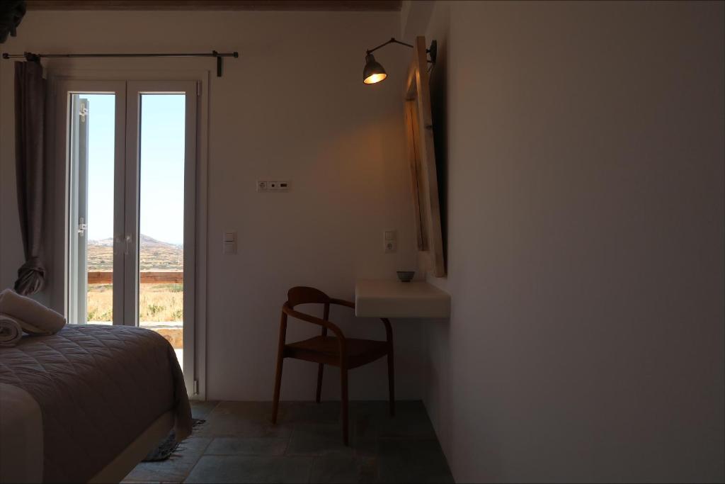 Postel nebo postele na pokoji v ubytování Elysian Villas Ios