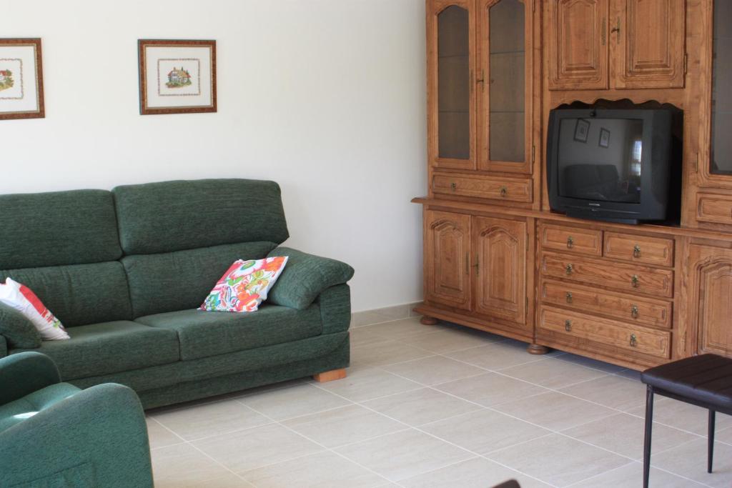 TV a/nebo společenská místnost v ubytování Apartamento Avenida