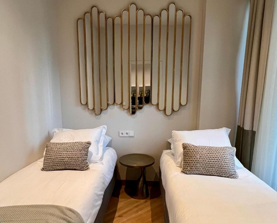 Posteľ alebo postele v izbe v ubytovaní Comfy Studios Hotel