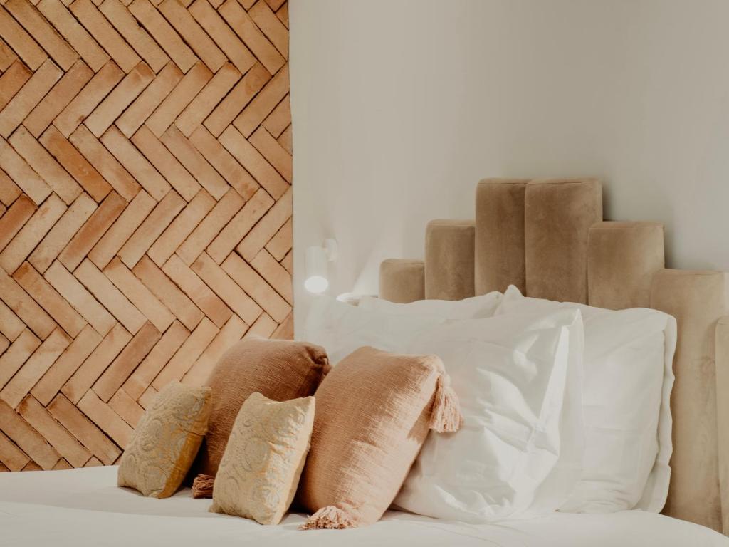 Posteľ alebo postele v izbe v ubytovaní Comfy Studios Hotel