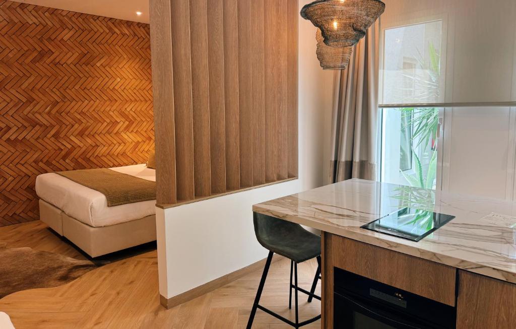 Posteľ alebo postele v izbe v ubytovaní Comfy Studios Hotel