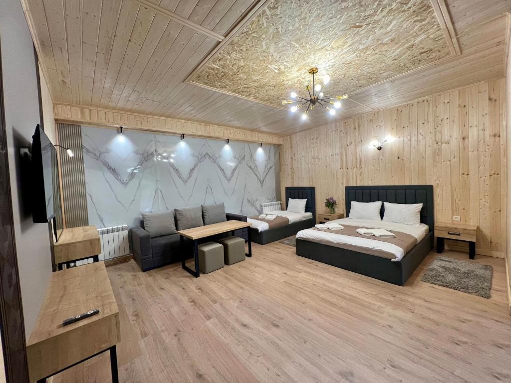Postel nebo postele na pokoji v ubytování Milenium magic villas on Sevan beach
