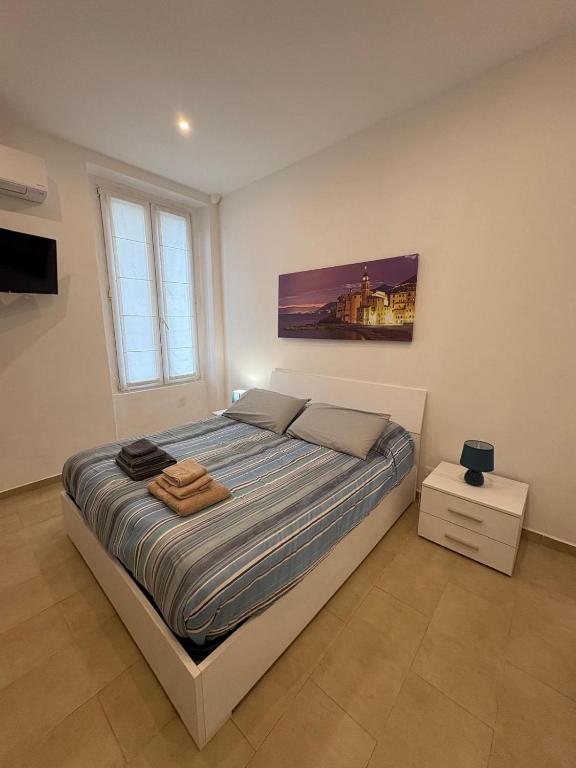 a bedroom with a large bed in a room at Casa Alimonda in Genoa