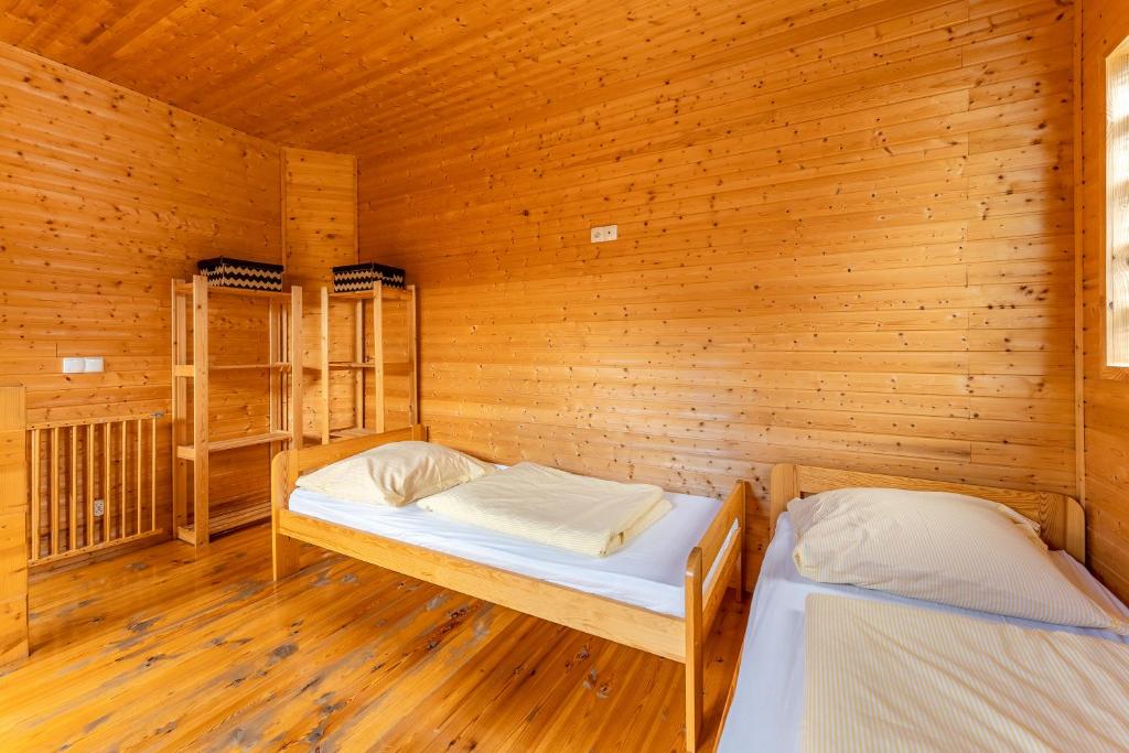 Posteľ alebo postele v izbe v ubytovaní Apartamenty Kompas