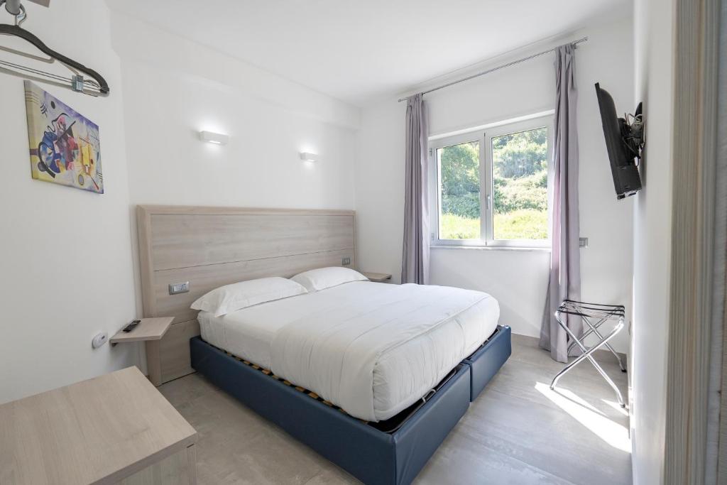 Posteľ alebo postele v izbe v ubytovaní Residenza Timpa Janca